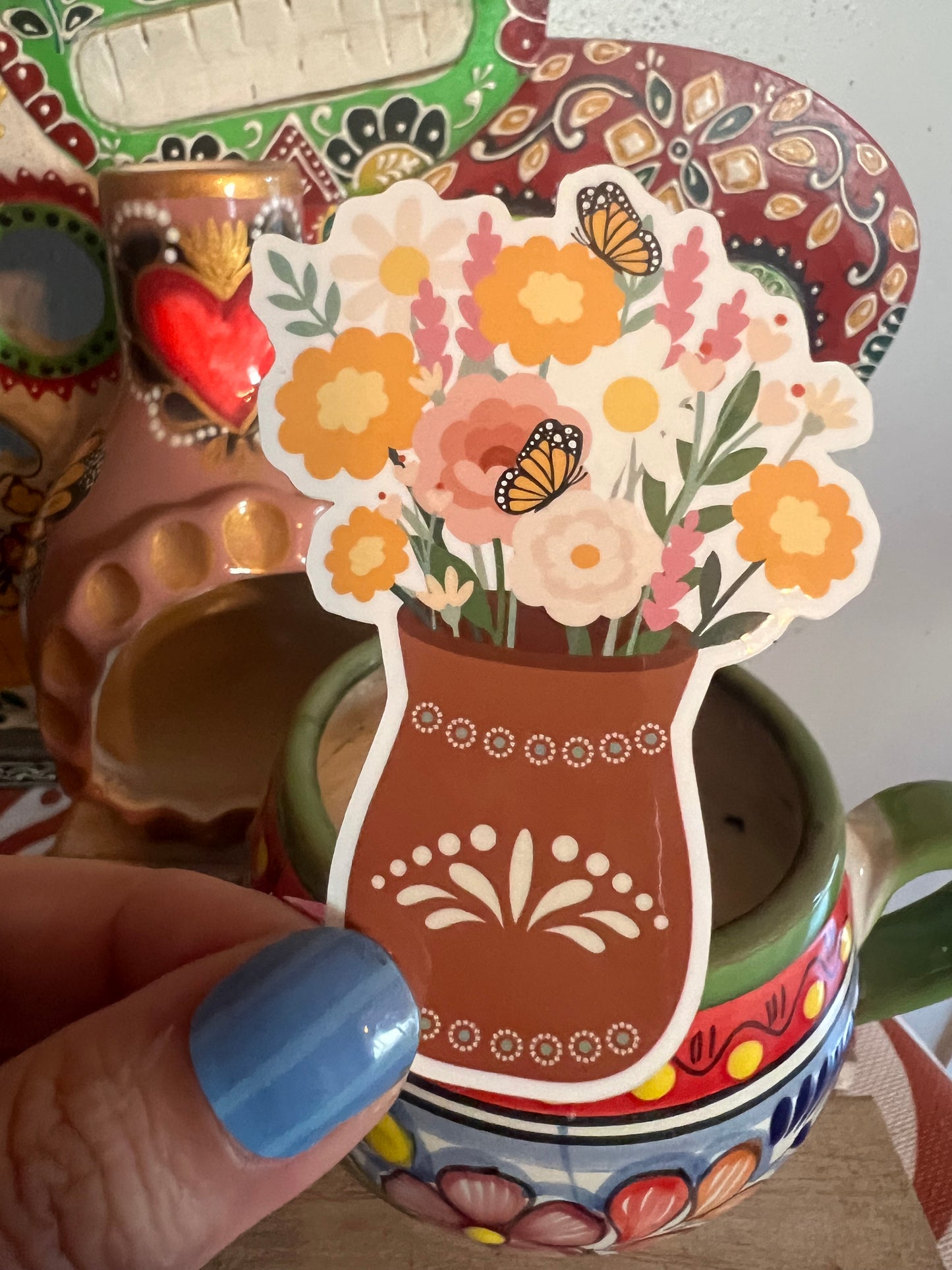 Sticker illustration of Mexica style vase with flowers and Butterflies