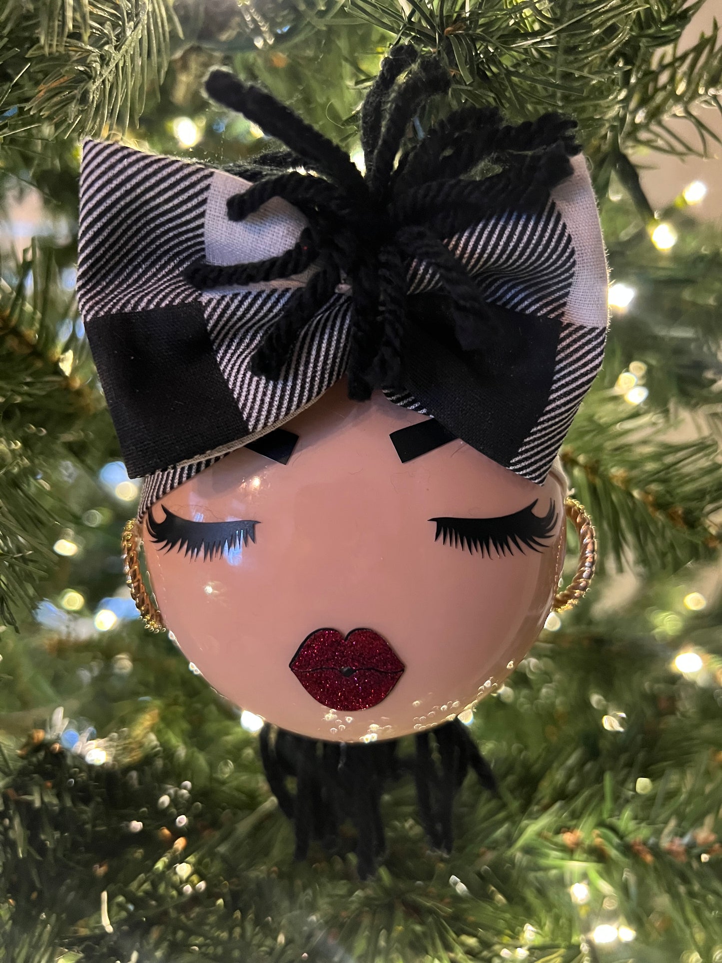 Decorative ornament with a black and white checkered bandana on a Christmas tree 