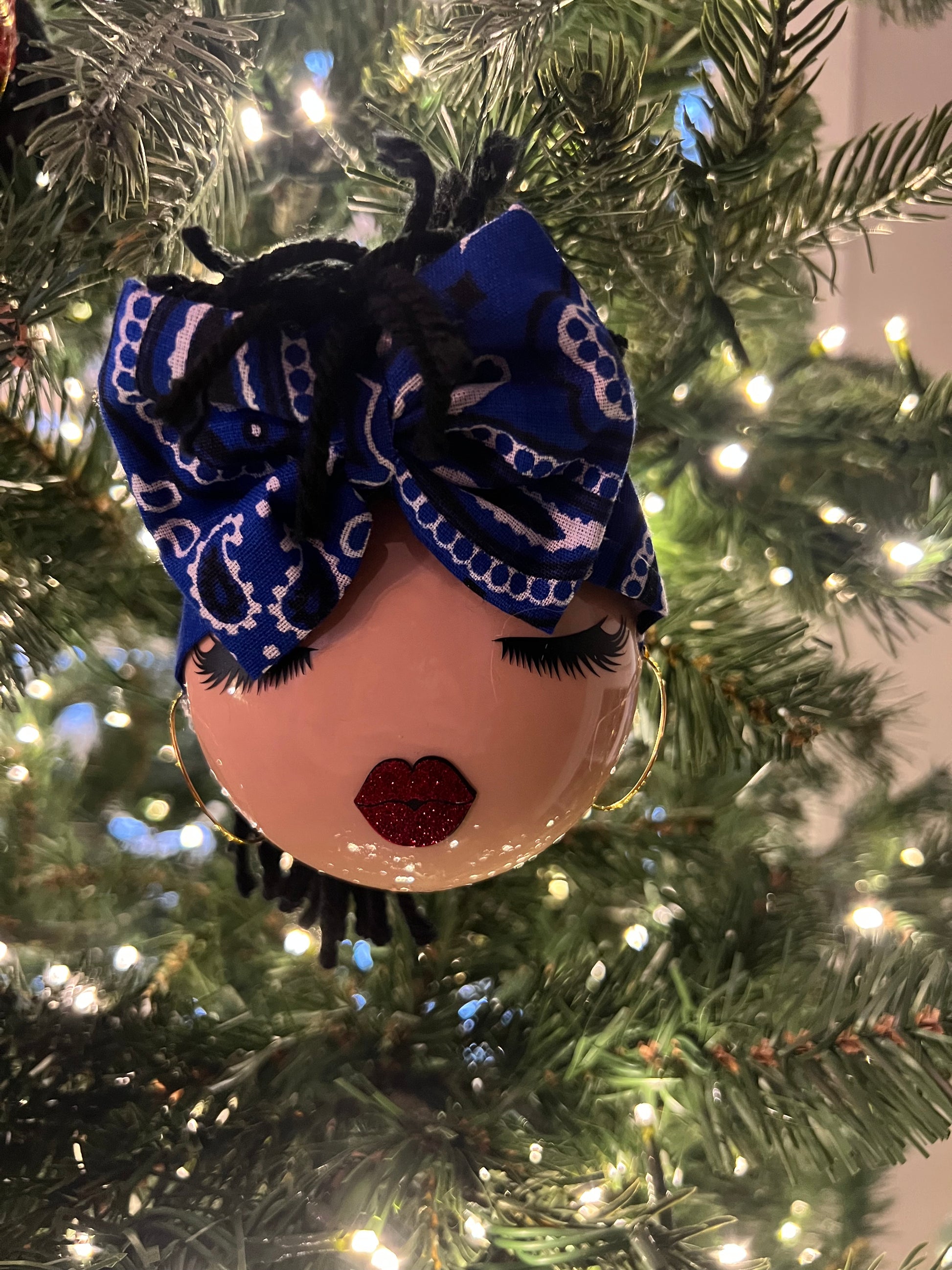 Decorative ornament with a blue bandana  on a Christmas tree.